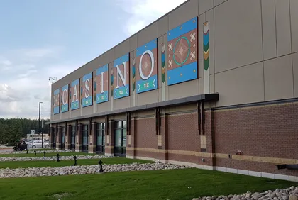 The east side of River Cree Resort and Casino near the main entrance, with large CASINO letters on painted panels, photographed in 2019